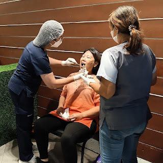 Beneficiaries avail of free oral screenings, dental exams, and procedures during the SM Foundation medical and dental mission at SM City Marilao.