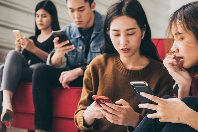 asian people are focusing on smartphones while sit 2023 11 27 04 53 31 utc